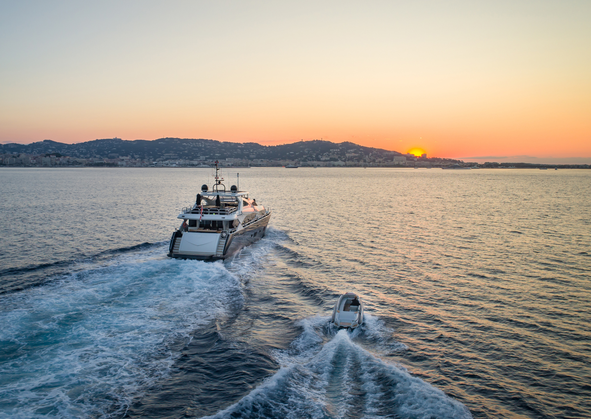 A Super Yacht Motoring at Sunset